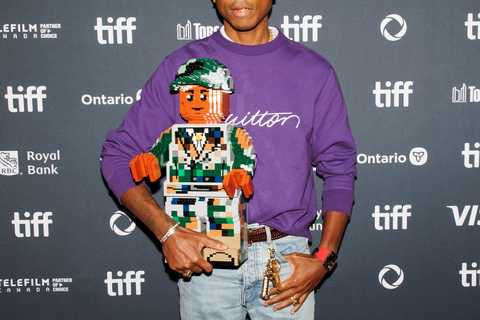 Pharrell Williams arrives on the red carpet for the premiere of 'Piece by Piece' at the Princess of Wales Theatre during the Toronto International Film Festival in Toronto, Tuesday, Sept. 10, 2024. (Cole Burston/The Canadian Press via AP)