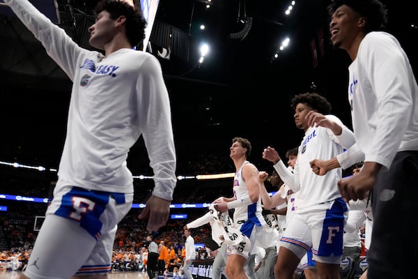 The Florida bench cheers play against Tennessee during the second half of an NCAA college basketball game in the final round of the Southeastern Conference tournament, Sunday, March 16, 2025, in Nashville, Tenn. (AP Photo/George Walker IV)