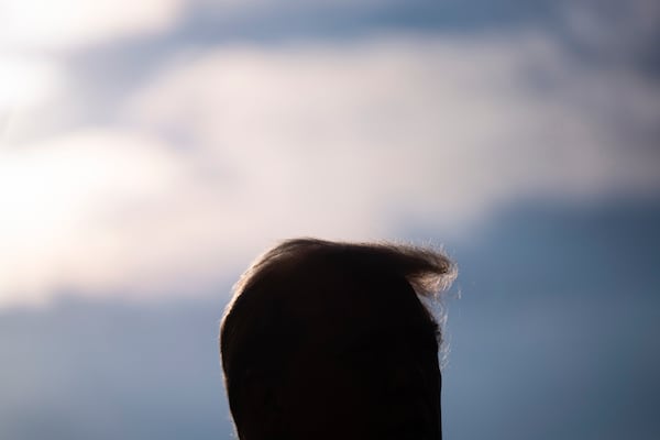 President Donald Trump speaks with reporters before boarding Marine One on the South Lawn of the White House, Friday, Jan. 24, 2025, in Washington. (AP Photo/Evan Vucci)