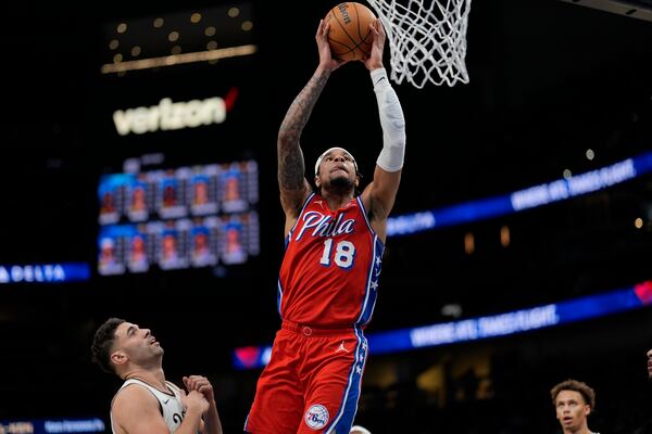 Philadelphia 76ers forward Chuma Okeke (18) shoots against Atlanta Hawks forward Georges Niang (20) during the first half of an NBA basketball game, Sunday, March 23, 2025, in Atlanta. (AP Photo/Mike Stewart)