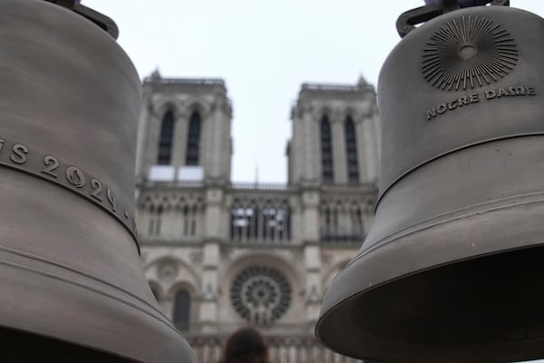 The bell that Olympic medalists rang at the Paris Games, left, and another bell are seen before their installation in Notre-Dame cathedral, ahead of the monument's grandiose reopening following a massive fire and five-year reconstruction effort, Thursday, Nov. 7, 2024 in Paris. (AP Photo/Christophe Ena)