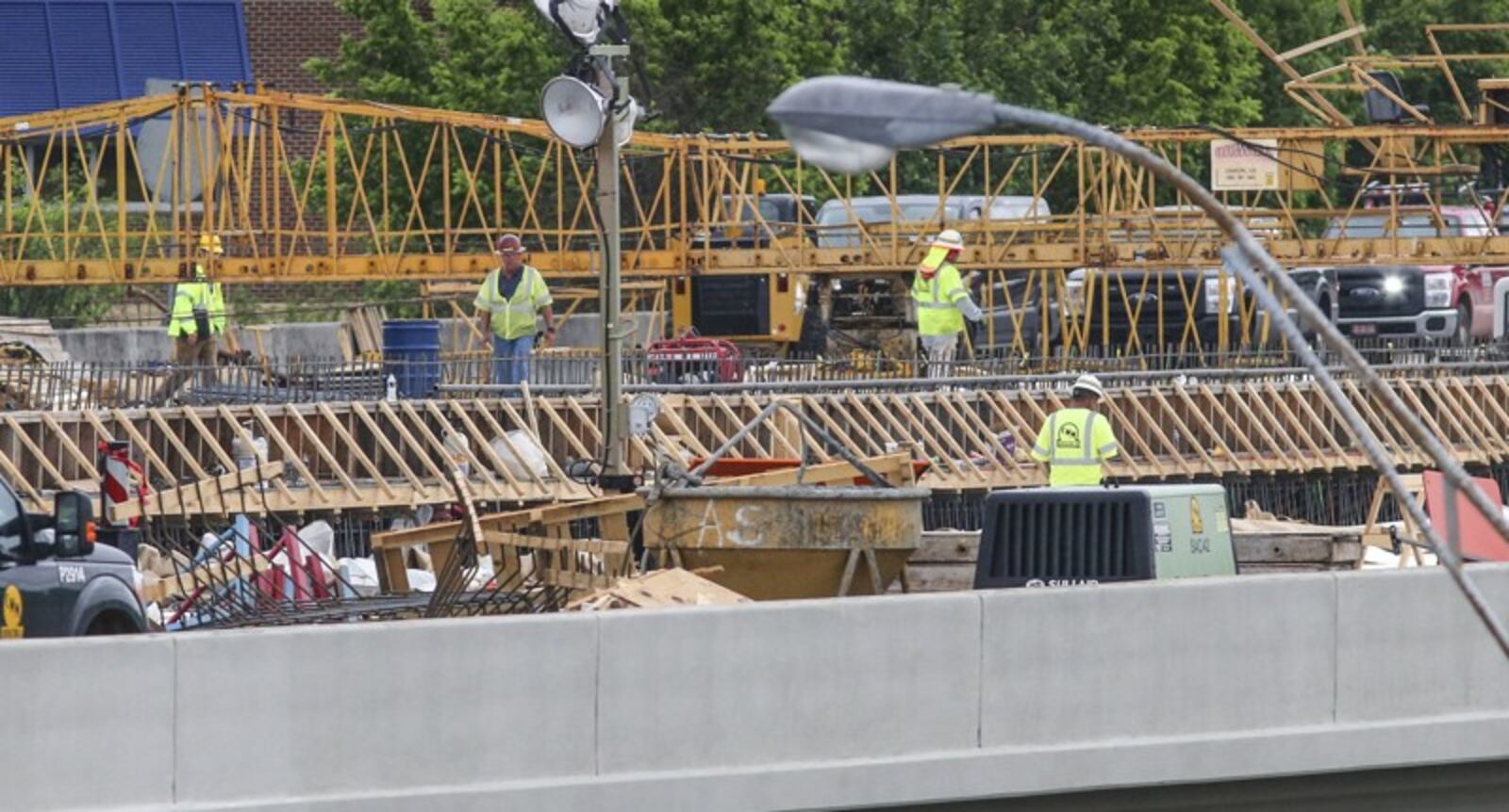 Work continued May 1 on the new I-85 bridge in Buckhead. Since a fire led to the collapse of a segment of I-85 in Buckhead on March 30, the Georgia Department of Transportation has scrambled to reopen the vital stretch of highway into the heart of Atlanta. Contractor C.W. Matthews is rebuilding 350 feet of northbound and 350 feet of southbound lanes on I-85. JOHN SPINK/JSPINK@AJC.COM