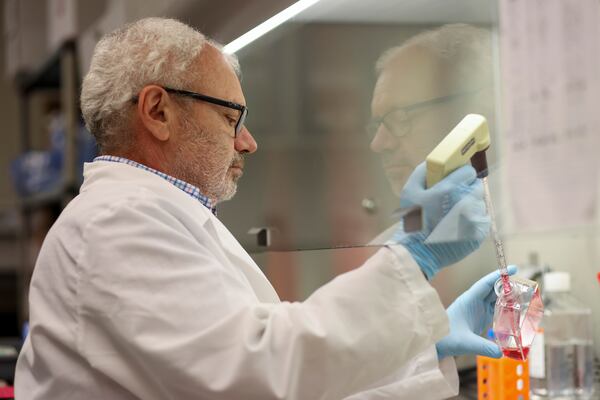 Arban Domi, GeoVax's director of vaccine development, works in the firm's Smyrna laboratory.