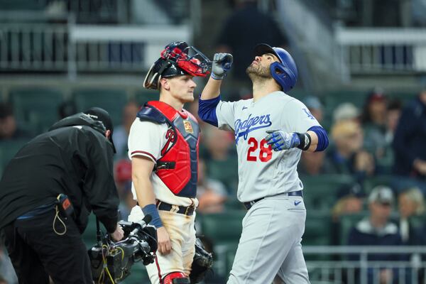 Los Angeles Dodgers designated hitter J.D. Martinez (28) celebrates his solo home run as he walks across home plate next to Atlanta Braves catcher Sean Murphy during the seventh inning. (Jason Getz / Jason.Getz@ajc.com)