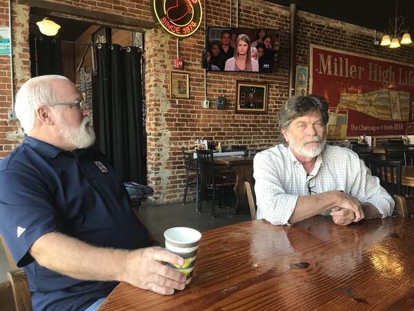 Manuel’s Tavern employee Bobby Agee (left) and Taquería del Sol co-owner Mike Klank discuss the period in the 1970s and ’80s, when they worked together at the Atlanta bar. LIGAYA FIGUERAS / LFIGUERAS@AJC.COM