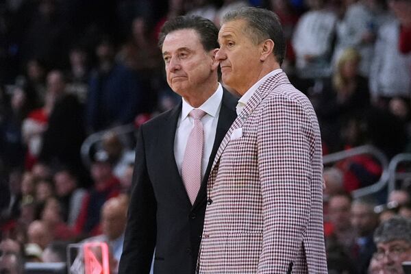 St. John's head coach Rick Pitino, right, stands with Arkansas head coach John Calipari after St. John's loss in the second round of the NCAA college basketball tournament, Saturday, March 22, 2025, in Providence, R.I. (AP Photo/Charles Krupa)