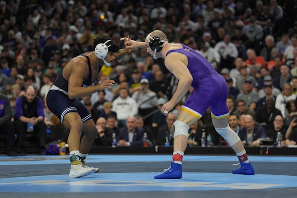 Penn State's Carter Starocci, left, takes on Northern Iowa's Parker Keckeisen during a 184-pound match in the finals at the NCAA wrestling championship, Saturday, March 22, 2025, in Philadelphia. (AP Photo/Matt Rourke)