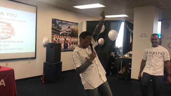 Delta’s vice president reservation sales and customer care Charisse Evans speaks to employees at the company’s reservation center in Atlanta