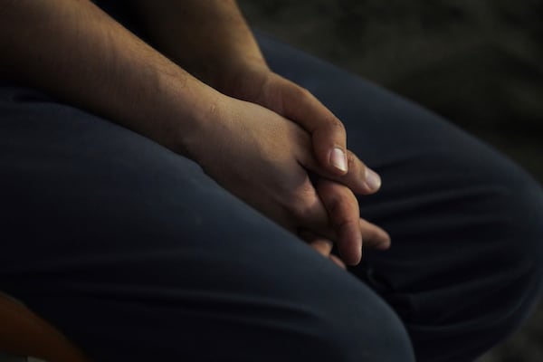 Rahmani, an Afghan refugee who is unable to pay his rent due to the cuts made to the federal refugee program by the Trump administration, sits in his apartment in Laurel, Md., Monday, March 3, 2025. (AP Photo/Jessie Wardarski)