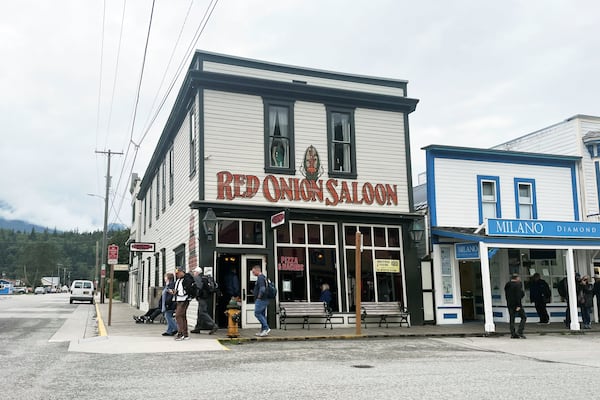 FILE - Visitors walk in the downtown area of Skagway, Alaska, Wednesday, July 31, 2024. (AP Photo/Mark Thiessen, File)