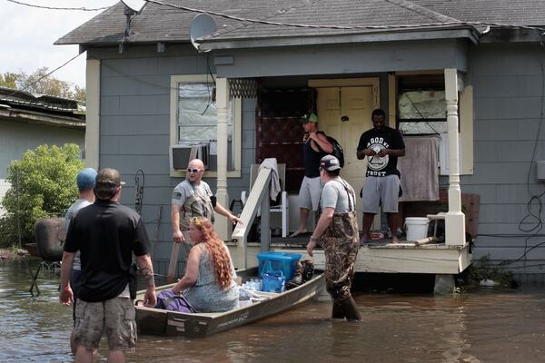 Members of the Wounded Veterans of Oklahoma help rescue flood victims Sept. 2, 2017, after torrential rains from Hurricane and Tropical Storm Harvey caused widespread flooding in Orange, Texas. Harvey, which made landfall north of Corpus Christi on Aug. 25, dumped more than 50 inches of rain in and around Houston.