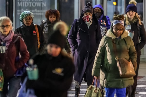 Emory University Hospital Midtown workers bundled up against the cold last month.