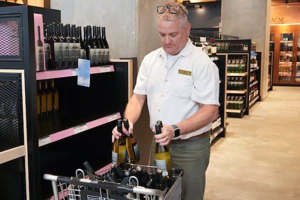 Wine produced in the United States is removed from the shelves of an LCBO store, in response to tariffs imposed on Canadian goods by U.S. President Donald Trump, in Toronto on Tuesday March 4, 2025. (Chris Young/The Canadian Press via AP)