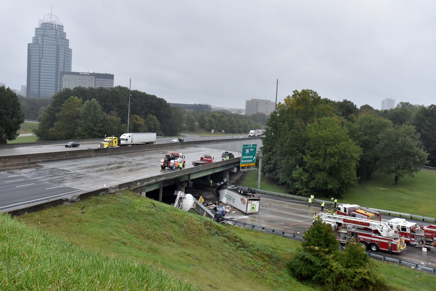 I-285 crash: Trucks plunge off interstate onto Ga. 400