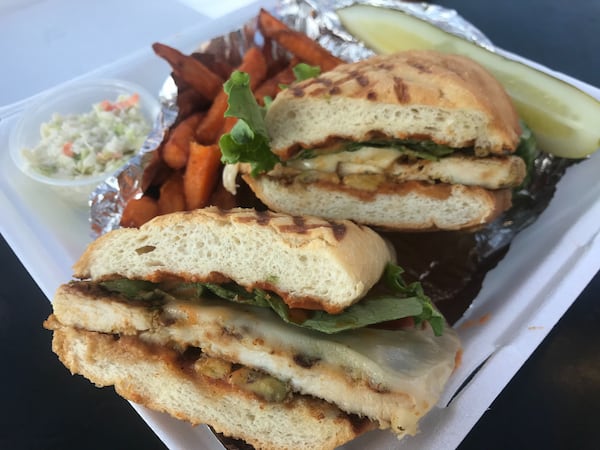 Peachtree Cafe offers a handful of sandwiches, including the hot, handheld California Panini, which features grilled chicken, sliced avocado, Swiss cheese, lettuce, tomato and chipotle ranch dressing. LIGAYA FIGUERAS / LIGAYA.FIGUERAS@AJC.COM