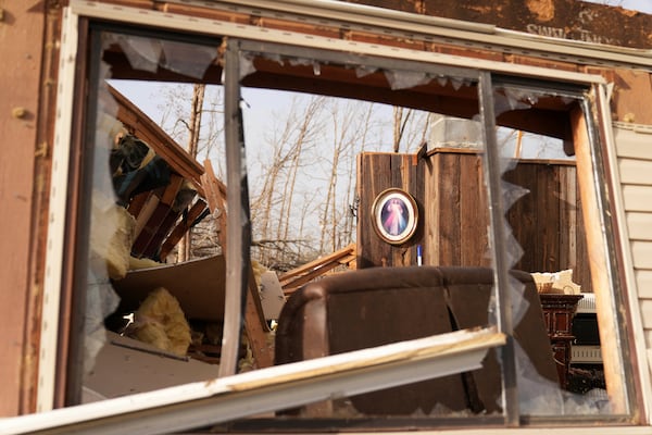 A image of Jesus hangs displayed inside a home belonging to Tim Scott, who was standing near the image when his house was destroyed by a severe storm the evening before, Saturday, March 15, 2025, in Wayne County, Mo. (AP Photo/Jeff Roberson)