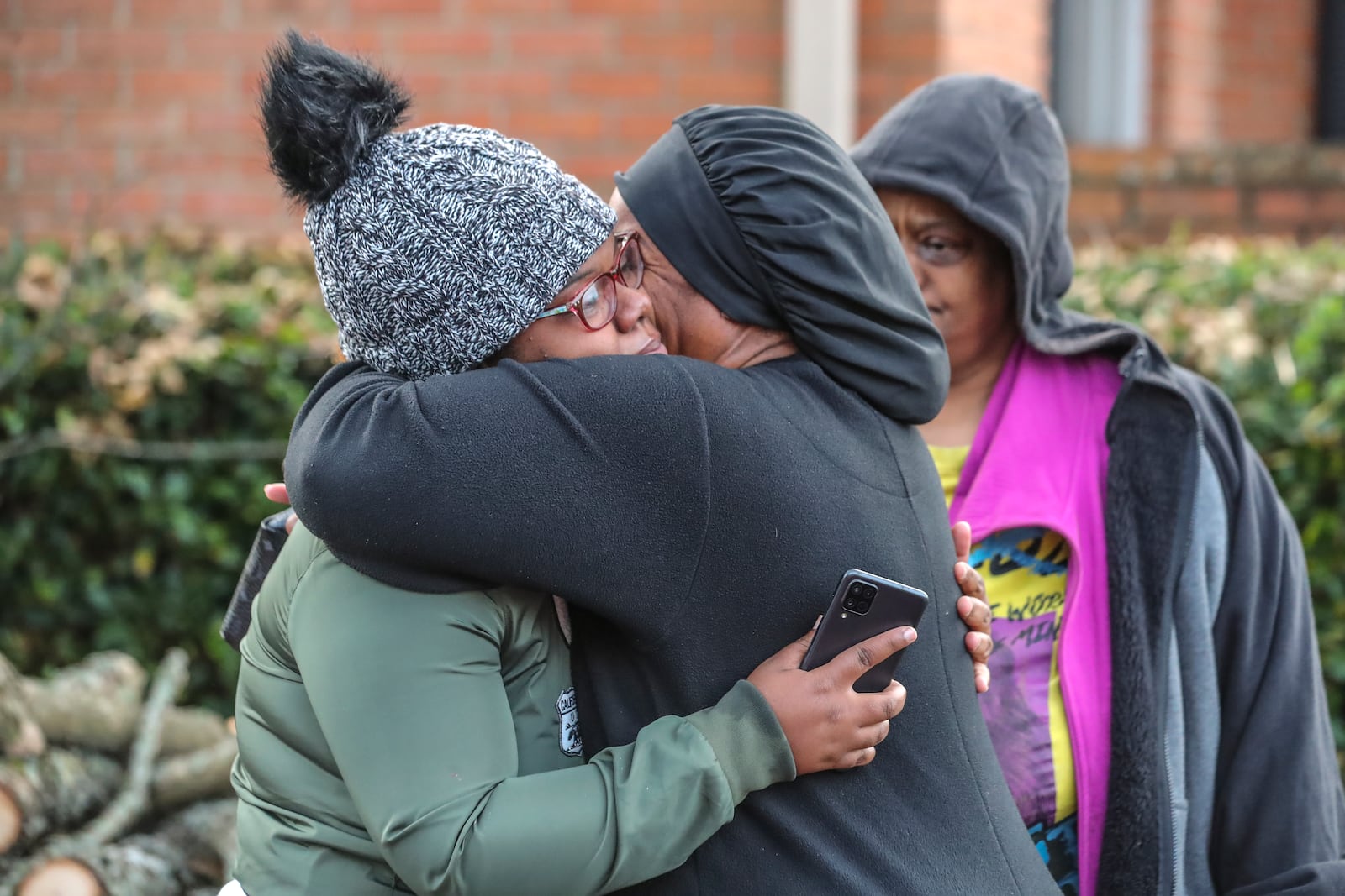 November 10, 2021 DeKalb County: Deonna Bray (left) is hugged by Kenyatta Kinnemore (right) while waiting on news on Bray’s missing son, 1-year old  Blaise Barnett who was taken when the car he was in was stolen while his parents were offloading groceries in front of their Clarkston apartments at Parc 1000 on 1000 Montreal Road. on Wednesday Nov. 10, 2021. It took maybe 30 seconds for the family of Blaise Barnett to take their eyes off the 1-year-old boy as they unloaded groceries Wednesday morning, and he was gone. In that time, someone climbed into the driver’s seat of their gray Ford Explorer and took off with the toddler, wearing only a diaper and a black shirt with blue dinosaurs, still strapped in his car seat. An Amber Alert was issued for the child early Wednesday, and neither he nor his family’s vehicle has been located in the nine hours since. “I just kept saying this is a dream. This just can’t be real,” his father, Xavier Barnett, told The Atlanta Journal-Constitution from outside his Clarkston apartment as the search continued. “I just broke down. Please, bring him home. The car don’t even matter, just bring my son home.” Blaise Barnett was reported missing at 1 a.m. from the Parc 1000 apartments at 1000 Montreal Road. According to a police report, Blaise’s parents were running bags of groceries to their apartment and returned to the parking lot to find their vehicle and their son gone. His father told police he carried his 3-year-old nephew inside first and was coming back for the toddler. “He was in there for probably like 30 seconds, maybe, and within those 30 seconds he came back outside and the car was gone with Blaise in it,” Deonna Bray, the child’s mother, told the AJC. The vehicle was not left running, but its keys were in the cupholder, according to the report. Blaise was strapped into a black and tan car seat and had a blanket wrapped around his legs, his parents told police. The GBI issued the alert, known as a Levi’s Call in Georgia, on behalf of the Clarkston Police Department. The Barnett family said the toddler’s name was misspelled in the alert. There have been no sightings as of 10:30 a.m. Wednesday, and police have not located the vehicle on any surveillance cameras in the area. Investigators have not developed any leads, Clarkston police Chief Christine Hudson told reporters as the search entered the 10th hour. The police department has devoted all of its resources, including patrol officers and detectives, to canvassing the area. DeKalb County police, the GBI and the FBI are also out looking for Blaise. “This is now a nationwide search,” the chief said, adding she wished she had more to give the Barnett and Bray families. “Waiting, that is the hardest part,” Deonna Bray said. “Not knowing. The waiting.” Blaise is believed to be traveling in the gray 2002 Ford Explorer, which has a temporary Georgia tag P2722946. According to the police report, there are wooden sticks holding up two back windows. Anyone who spots the child or the vehicle is asked to call Clarkston police at 404-557-8956 or dial 911. (John Spink / John.Spink@ajc.com)


