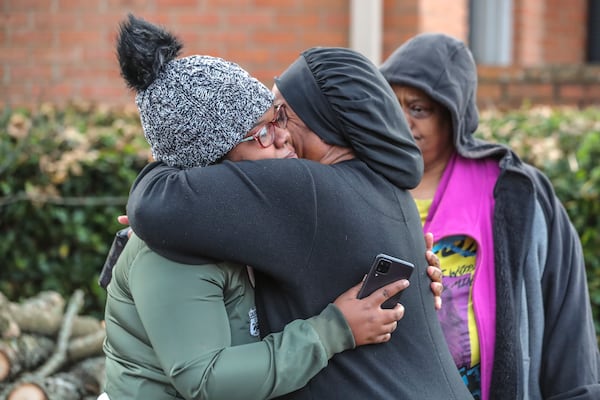 November 10, 2021 DeKalb County: Deonna Bray (left) is hugged by Kenyatta Kinnemore (right) while waiting on news on Bray’s missing son, 1-year old  Blaise Barnett who was taken when the car he was in was stolen while his parents were offloading groceries in front of their Clarkston apartments at Parc 1000 on 1000 Montreal Road. on Wednesday Nov. 10, 2021. It took maybe 30 seconds for the family of Blaise Barnett to take their eyes off the 1-year-old boy as they unloaded groceries Wednesday morning, and he was gone. In that time, someone climbed into the driver’s seat of their gray Ford Explorer and took off with the toddler, wearing only a diaper and a black shirt with blue dinosaurs, still strapped in his car seat. An Amber Alert was issued for the child early Wednesday, and neither he nor his family’s vehicle has been located in the nine hours since. “I just kept saying this is a dream. This just can’t be real,” his father, Xavier Barnett, told The Atlanta Journal-Constitution from outside his Clarkston apartment as the search continued. “I just broke down. Please, bring him home. The car don’t even matter, just bring my son home.” Blaise Barnett was reported missing at 1 a.m. from the Parc 1000 apartments at 1000 Montreal Road. According to a police report, Blaise’s parents were running bags of groceries to their apartment and returned to the parking lot to find their vehicle and their son gone. His father told police he carried his 3-year-old nephew inside first and was coming back for the toddler. “He was in there for probably like 30 seconds, maybe, and within those 30 seconds he came back outside and the car was gone with Blaise in it,” Deonna Bray, the child’s mother, told the AJC. The vehicle was not left running, but its keys were in the cupholder, according to the report. Blaise was strapped into a black and tan car seat and had a blanket wrapped around his legs, his parents told police. The GBI issued the alert, known as a Levi’s Call in Georgia, on behalf of the Clarkston Police Department. The Barnett family said the toddler’s name was misspelled in the alert. There have been no sightings as of 10:30 a.m. Wednesday, and police have not located the vehicle on any surveillance cameras in the area. Investigators have not developed any leads, Clarkston police Chief Christine Hudson told reporters as the search entered the 10th hour. The police department has devoted all of its resources, including patrol officers and detectives, to canvassing the area. DeKalb County police, the GBI and the FBI are also out looking for Blaise. “This is now a nationwide search,” the chief said, adding she wished she had more to give the Barnett and Bray families. “Waiting, that is the hardest part,” Deonna Bray said. “Not knowing. The waiting.” Blaise is believed to be traveling in the gray 2002 Ford Explorer, which has a temporary Georgia tag P2722946. According to the police report, there are wooden sticks holding up two back windows. Anyone who spots the child or the vehicle is asked to call Clarkston police at 404-557-8956 or dial 911. (John Spink / John.Spink@ajc.com)


