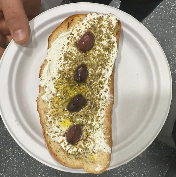 The labne toast from Mint Coffeehouse in Tucker features a piece of Italian toast topped with labne (kefir cheese), zatar seasoning and olives.