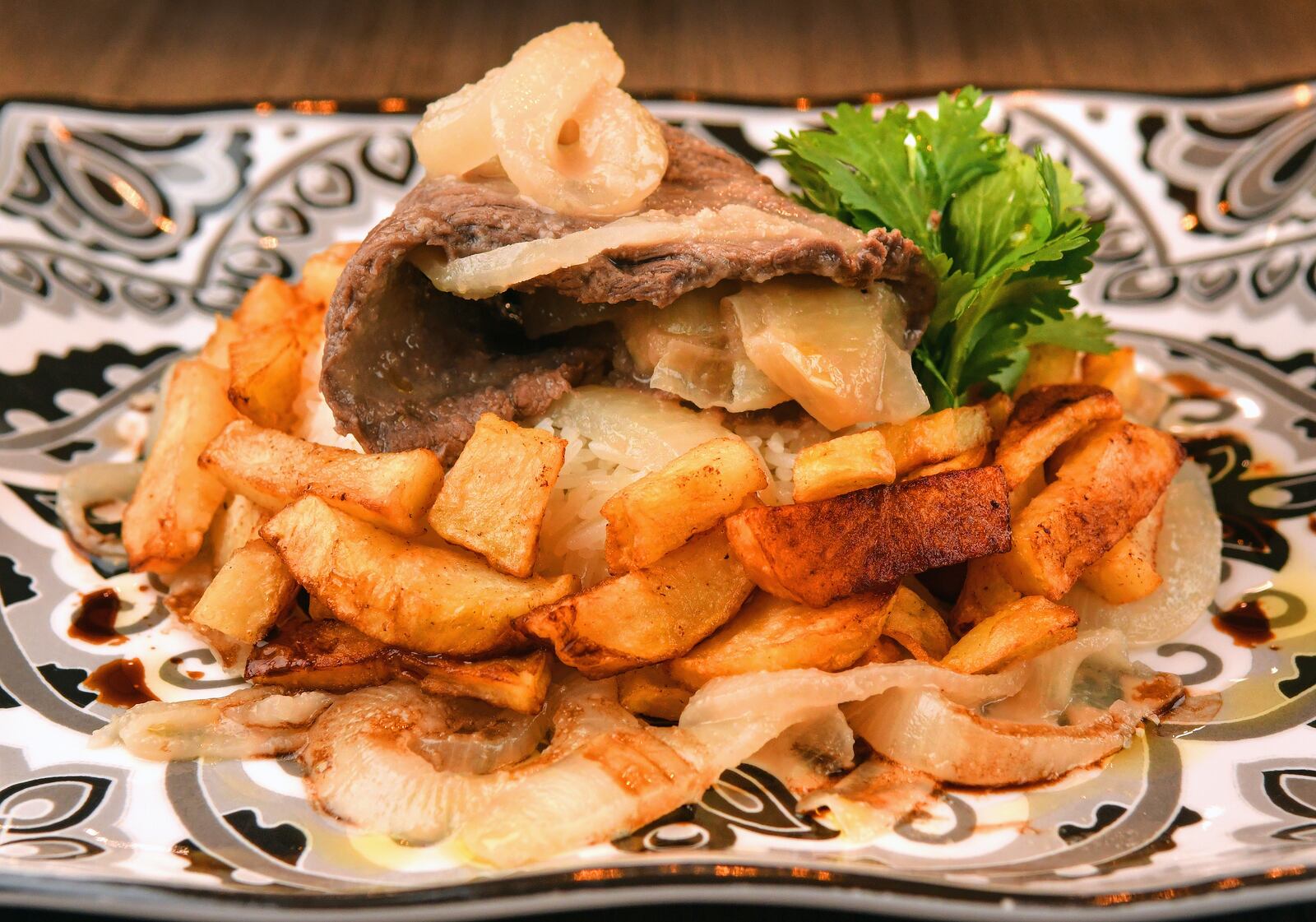 Bistec de Palomilla and French Fries. Food styling by Ozzy Llanes and Alex Valdivia / Chris Hunt /For The AJC