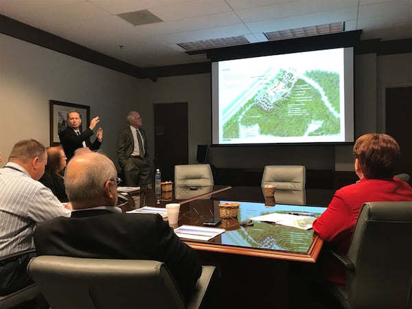 Gwinnett Commission Chairman Charlotte Nash (far right) and other commissioners listen to a Tuesday briefing about the design of the county’s planned $30 million “water innovation center.” TYLER ESTEP / TYLER.ESTEP@AJC.COM