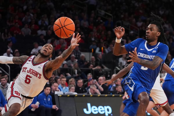 St. John's's Deivon Smith (5) reaches for the inbound pass to Creighton's Jamiya Neal (5) during the first half of an NCAA college basketball game in the championship of the Big East Conference tournament Saturday, March 15, 2025, in New York. (AP Photo/Frank Franklin II)