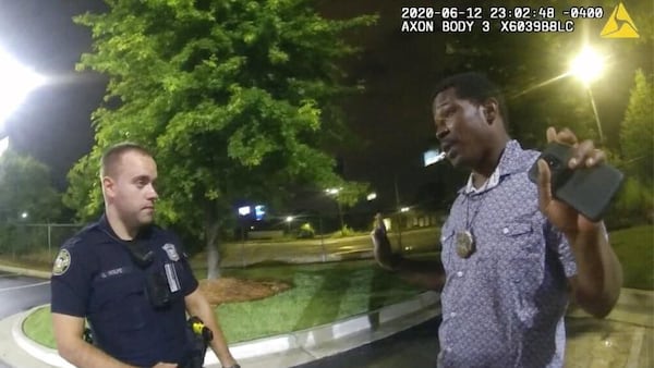 Atlanta Officer Garrett Rolfe speaks with Rayshard Brooks in the Wendy's parking lot. 