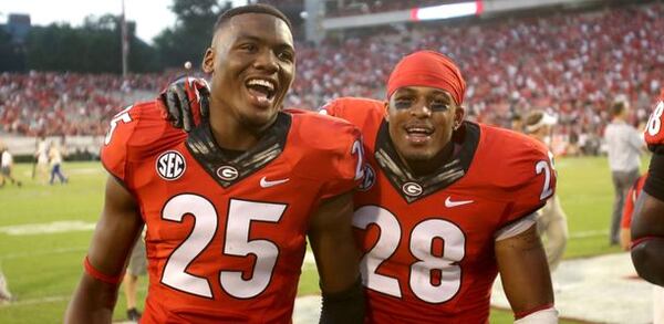 Josh-Harvey Clemons and Tray Matthews didn't misplay this photo op. (Jason Getz/AJC)