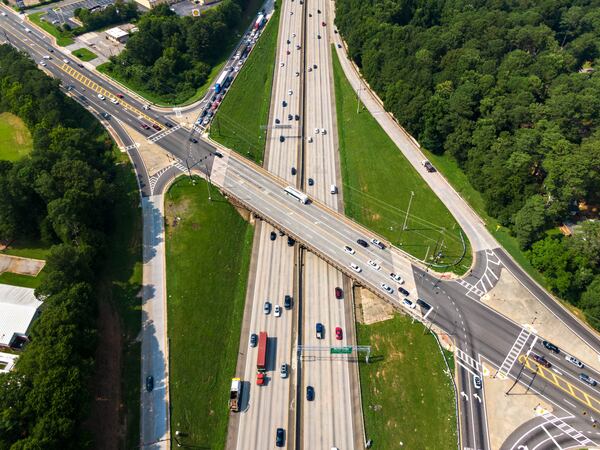 July 22, 2021 Atlanta - Aerial photo shows I-285 (L-southbound, R-northbound) on Thursday, July 22, 2021. Covington Highway overpass (center) are shown. New bridges over I-285 at Covington Highway, Redwing Circle and Glenwood Road. (Hyosub Shin / Hyosub.Shin@ajc.com)