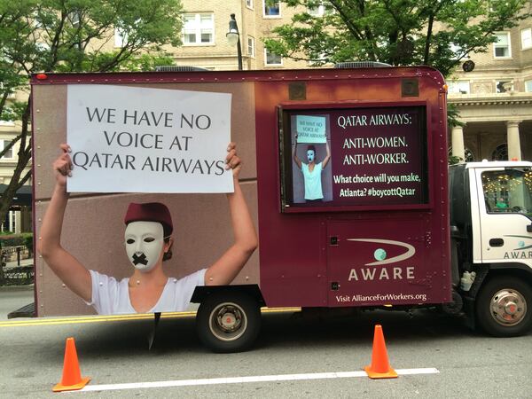 This mobile protest rolled past the Fox Theatre during Qatar Airways' launch party.