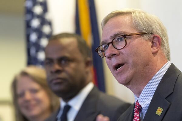 Raymond King, president and CEO of Zoo Atlanta, right, speaks during a press conference in Atlanta, Georgia, on Tuesday, April 25, 2017. The Grant Park Gateway Project aims alleviate traffic and address a lack of parking by constructing a new parking garage near Zoo Atlanta on Boulevard. DAVID BARNES / AJC