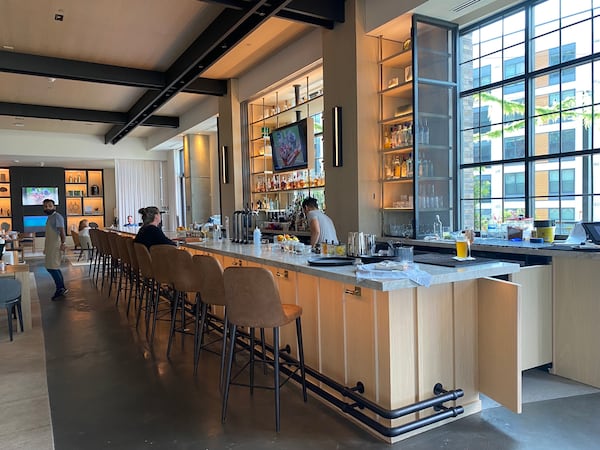 The interior of Drawbar, at the Bellyard Hotel in west Midtown, has high, industrial ceilings and plenty of elbow room. Ligaya Figueras/ligaya.figueras@ajc.com