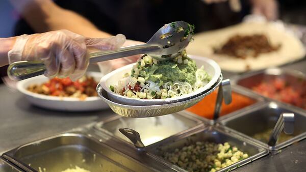 MIAMI, FL - APRIL 27:  Chipotle restaurant workers fill orders for customers on the day that the company announced it will only use non-GMO ingredients in its food on April 27, 2015 in Miami, Florida.  The company announced, that the Denver-based chain would not use the GMO's, which is an organism whose genome has been altered via genetic engineering in the food served at Chipotle Mexican Grills.  (Photo by Joe Raedle/Getty Images)