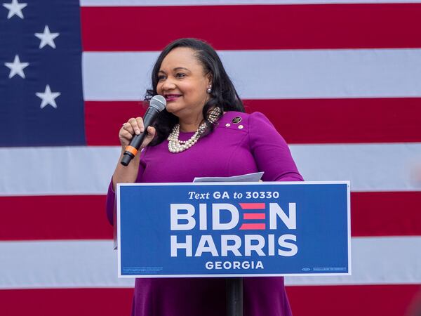 U.S. Rep. Nikema Williams, D-Ga., speaks at a Biden-Harris rally (right) in Decatur. Williams is now backing Vice President Kamala Harris for president.