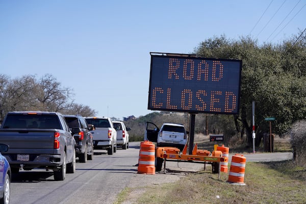 Gillespie County's Hwy 16 is closed due to the Crabapple Fire north of Fredericksburg, Texas, Sunday, March 16, 2025. (Robin Jerstad/The San Antonio Express-News via AP)