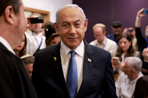 Israeli Prime Minister Benjamin Netanyahu arrives at the district court in Tel Aviv for his long-running trial for alleged corruption, in Tel Aviv, Israel, Tuesday, Dec. 10, 2024. (Menahem Kahana/Pool Photo via AP)