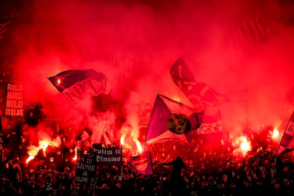 Dinamo fans light flares during the Champions League opening match between Dinamo Zagreb and Celtic at Maksimir Stadium in Zagreb, Croatia, on Tuesday, December 10, 2024. (AP Photo/Darko Vojinovic)