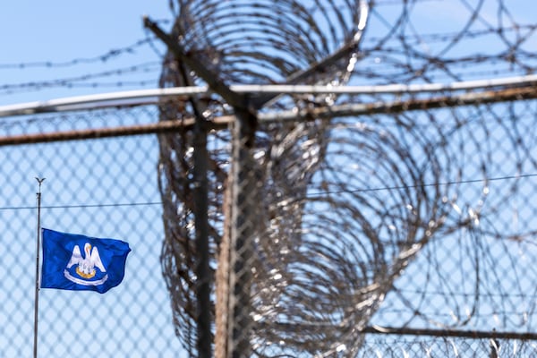 A Louisiana state flag flies at the entrance to the Louisiana State Penitentiary in Angola, La., Tuesday, March 18, 2025, on the day of the planned execution of Jessie Hoffman Jr., who was convicted in the 1996 murder of Mary "Molly" Elliott. (Chris Granger/The Times-Picayune/The New Orleans Advocate via AP)