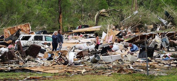 April 13, 2020 Chatsworth: Survivors and family friends dig through the remains of Deer Park trailer park after a deadly tornado killed at least 7 in Murray County on Monday, April 12, 2020, in Chatsworth. (Curtis Compton/ccompton@ajc.com)