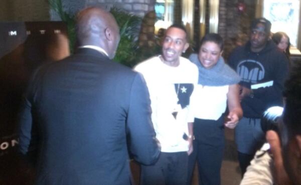 Ludacris, center, greets actor Adewale Akinnuoye-Agbaje at the "Concussion" red carpet.