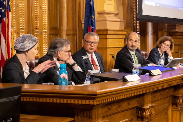 State Election Board members Sara Tindall Ghazal, Ed Lindsey, John Fervier, and Janice Johnston, along with Executive Director Mike Coan (center), hear a complaint against the Fulton County vote count at a State Election Board meeting earlier this month. (Arvin Temkar / AJC)