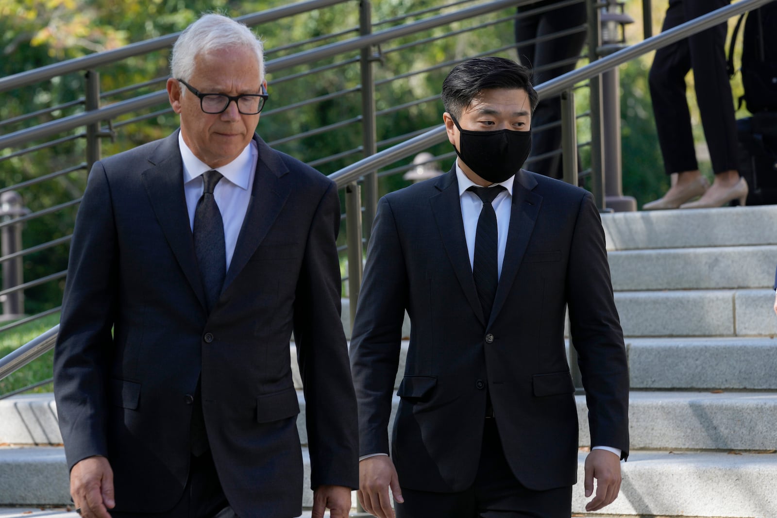 FILE - Attorney David Sanford, left, and Young Lee, right, brother of murder victim Hae Min Lee, walk over to talk with reporters outside Maryland's Supreme Court in Annapolis, Md., Oct. 5, 2023, following arguments in an appeal by Adnan Syed, whose conviction for killing his ex-girlfriend Hae Min Lee more than 20 years ago was chronicled in the hit podcast "Serial." (AP Photo/Susan Walsh, File)