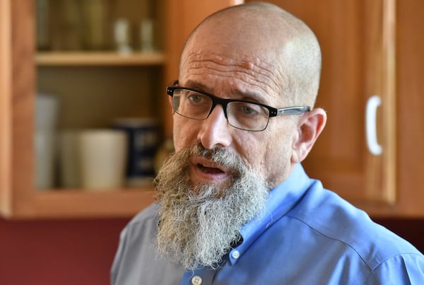 Immigration attorney Marty Rosenbluth stands inside his kitchen in Lumpkin. Rosenbluth says he has received a surge of calls in recent weeks from people looking to hire him, but he doesn’t think he will be able to help much. (Hyosub Shin/AJC 2018) 