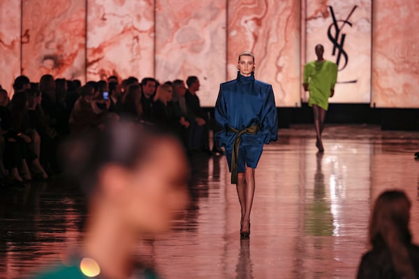 A model wears a creation as part of the Saint Laurent Fall/Winter 2025-2026 Womenswear collection presented Tuesday, March 11, 2025. in Paris. (AP Photo/Thomas Padilla)