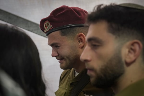 A soldier mourns during the funeral of combat engineer squad commander Staff Sgt. Zamir Burke, 20, from Beit Shemesh, during his funeral at Mount Herzl military cemetery in Jerusalem, Israel, Sunday Nov. 1, 2024. Burke was killed in combat with Hamas at the Jabaliya refugee camp in Gaza. (APcPhoto/Mahmoud Illean)