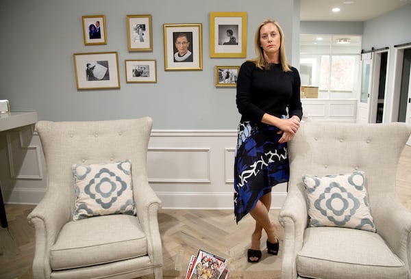 Eleanor's Place founder Jennifer Morgan stands in front of a collection of photographs of Ruth Bader Ginsburg at her private, women-only co-working space in Atlanta Saturday, September 19, 2020.  STEVE SCHAEFER / SPECIAL TO THE AJC 