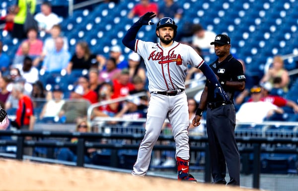 Atlanta Braves' Travis d'Arnaud celebrates at first after a single during the second inning of the team's baseball game against the Washington Nationals on Tuesday, June 14, 2022, in Washington. (AP Photo/Julia Nikhinson)