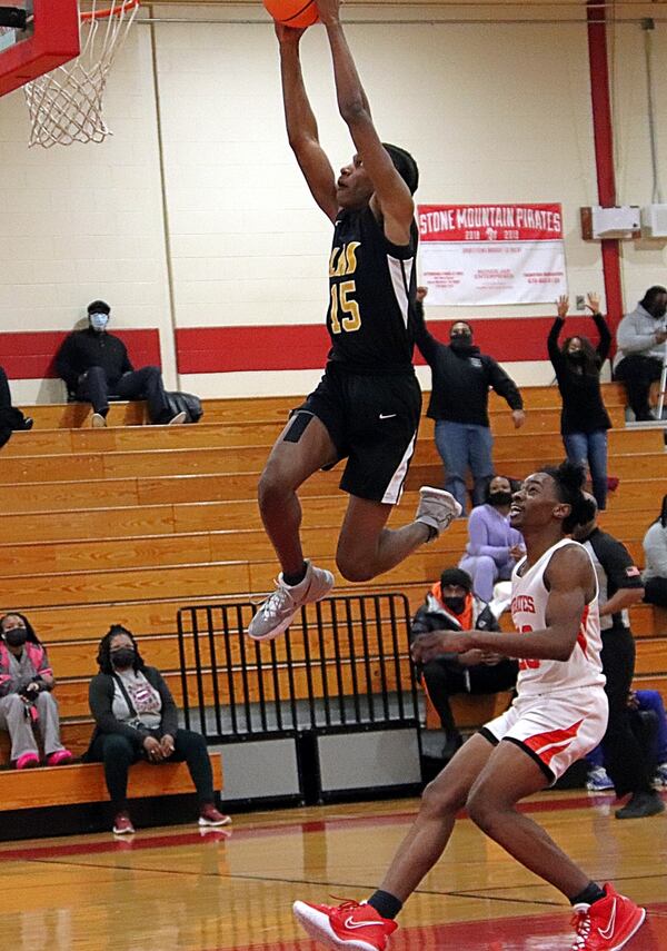 Lithonia's Josh Daniels goes high for the slam in a win over Stone Mountain on Jan. 4, 2022.