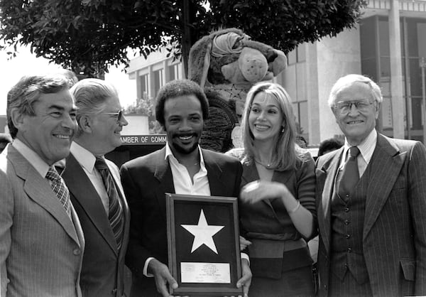 FILE - Musician Quincy Jones and his wife, actress Peggy Lipton, hold Jones' star which was placed in the Hollywood Walk of Fame in Los Angeles on March 14, 1980. (AP Photo/Barfield, File)