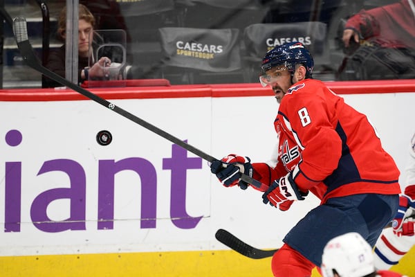 Washington Capitals left wing Alex Ovechkin (8) watches the puck during the third period of an NHL hockey game against the Montreal Canadiens, Thursday, Oct. 31, 2024, in Washington. The Capitals won 6-3. (AP Photo/Nick Wass)